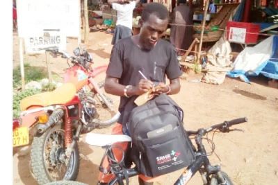 Coach Obua rents bike to deliver HIV medicines to less privileged in total lockdown