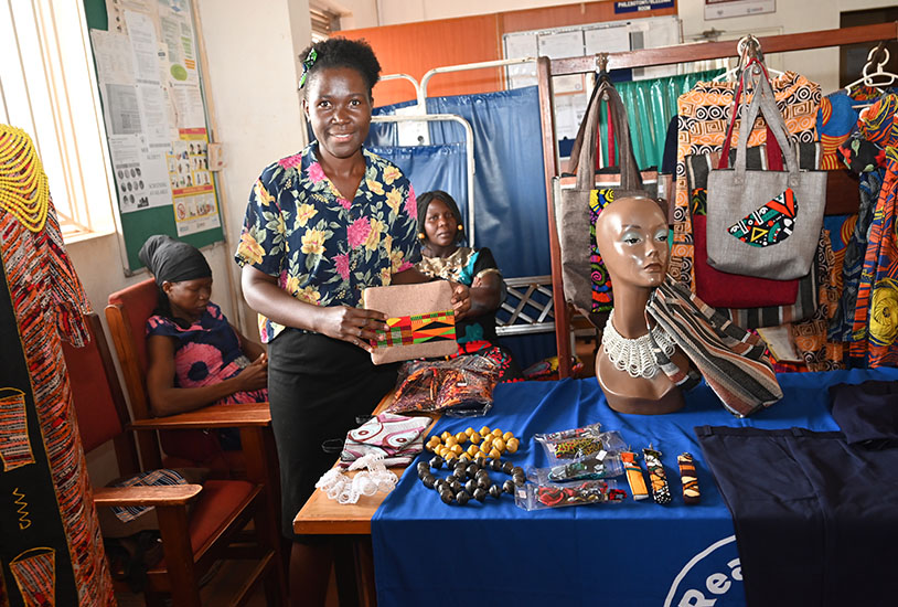 One of the MCC Project beneficiary showcasing some of her products during the visit.